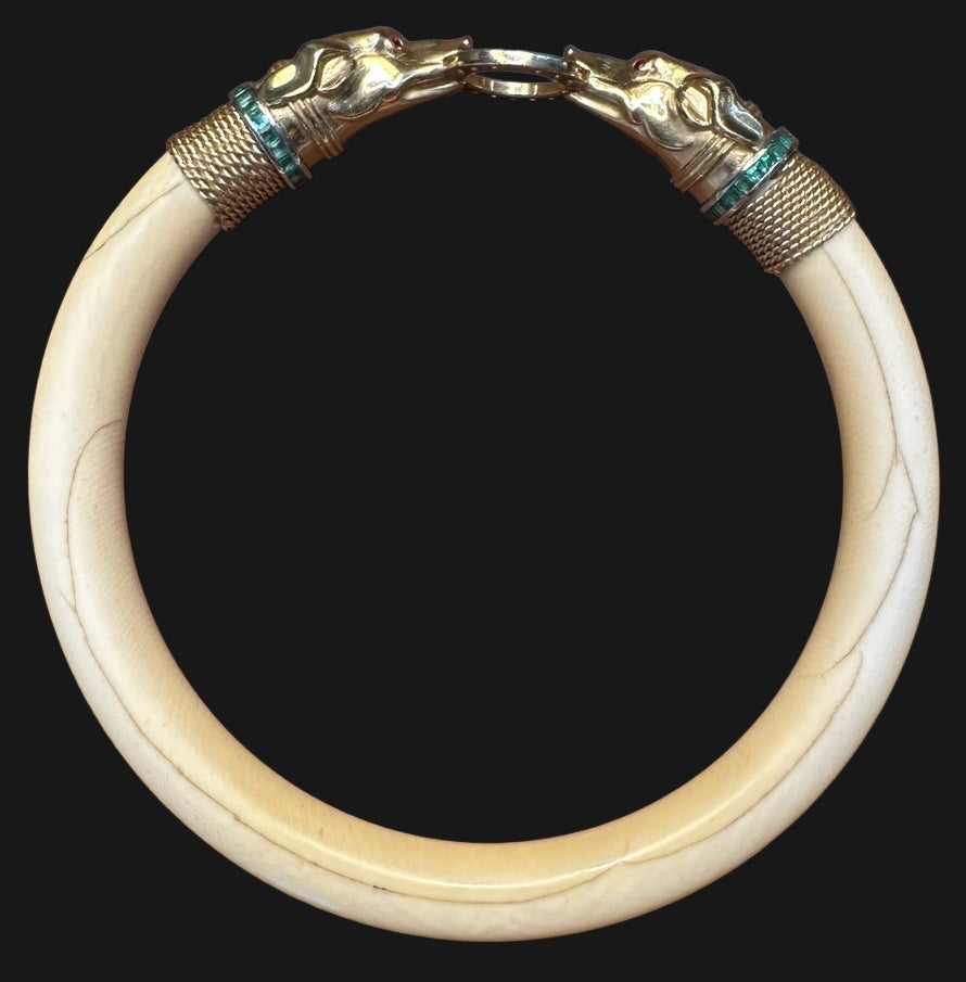 French Art Deco hound’s-head bone bangle, actual product photograph on black background