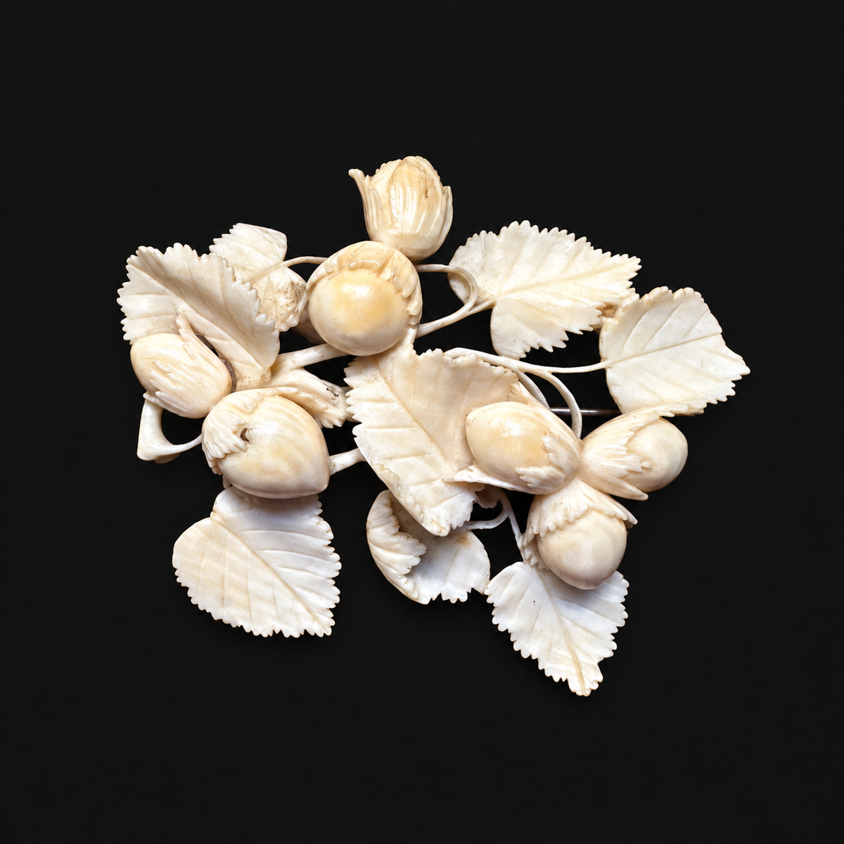 Early nineteenth-century carved bone hazelnut brooch