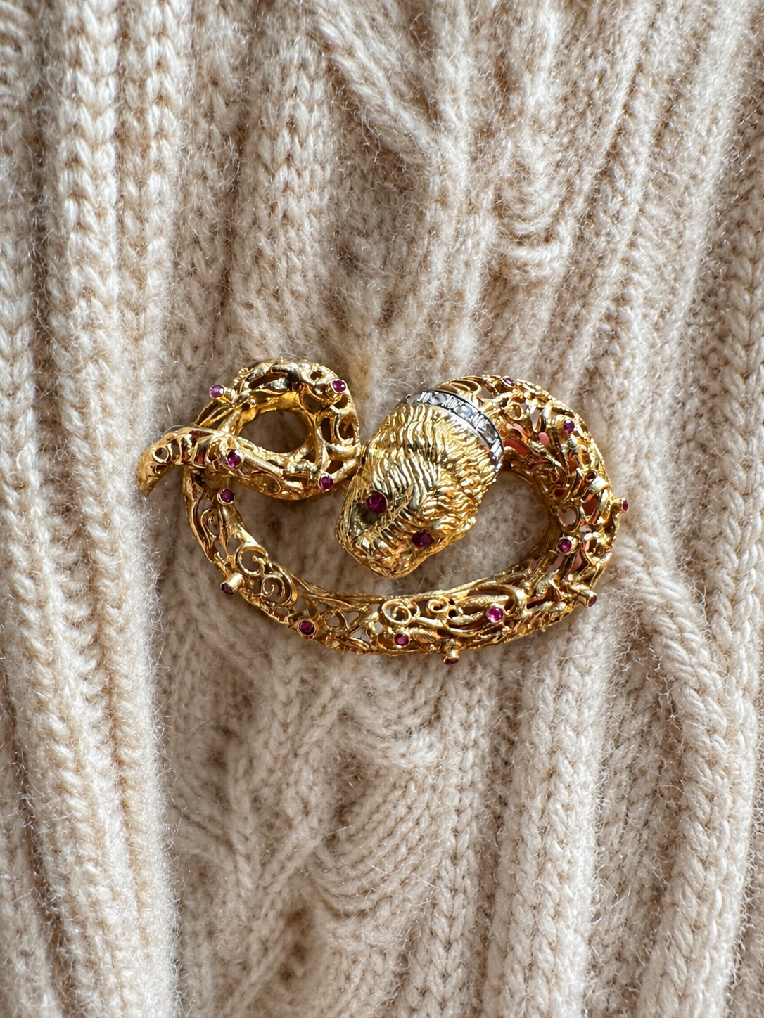 Sea-creature brooch styled on cream cashmere