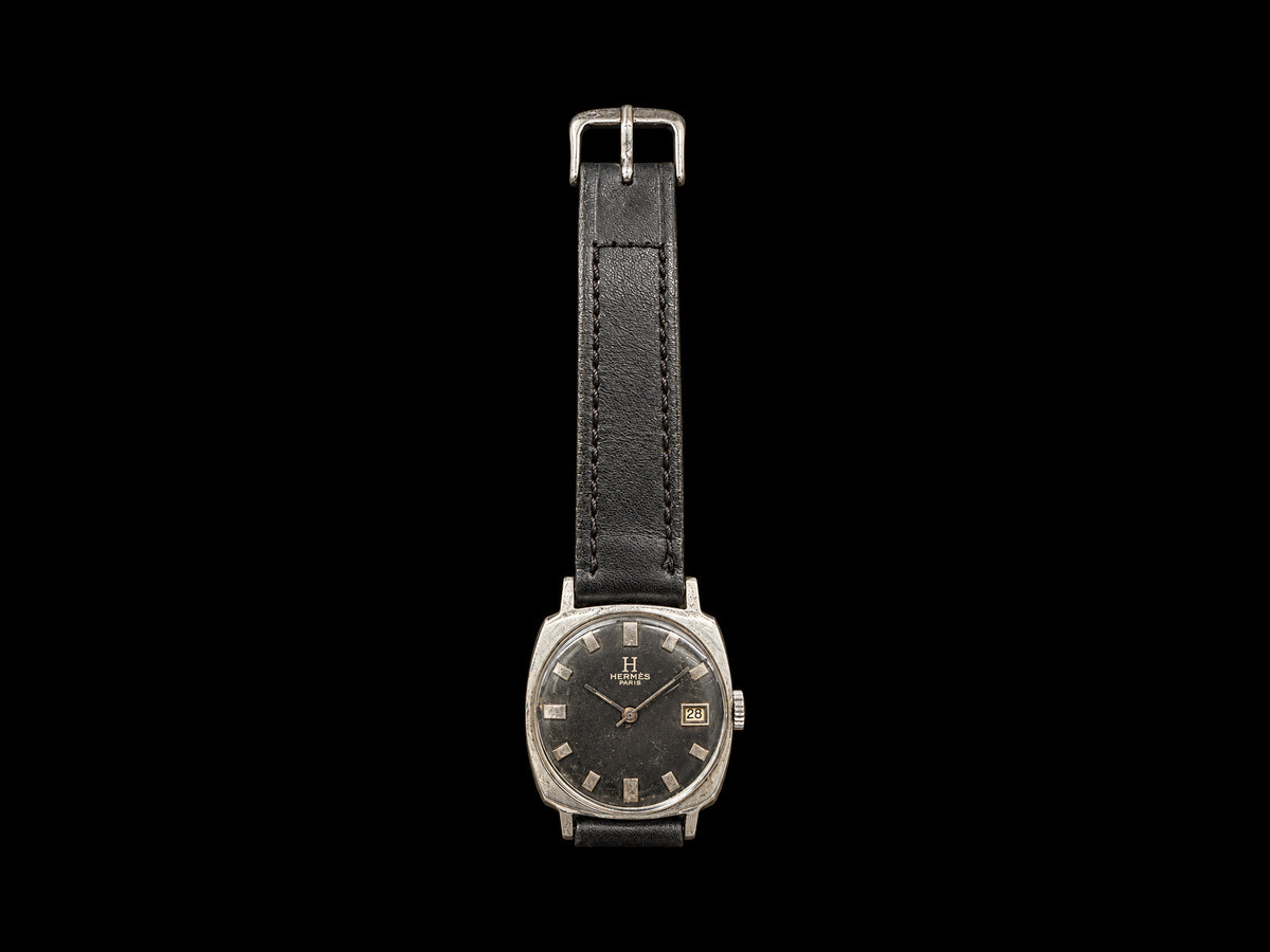 VINTAGE WATCH WITH HERMÈS SIGNED BLACK DIAL AND DATE — front view
