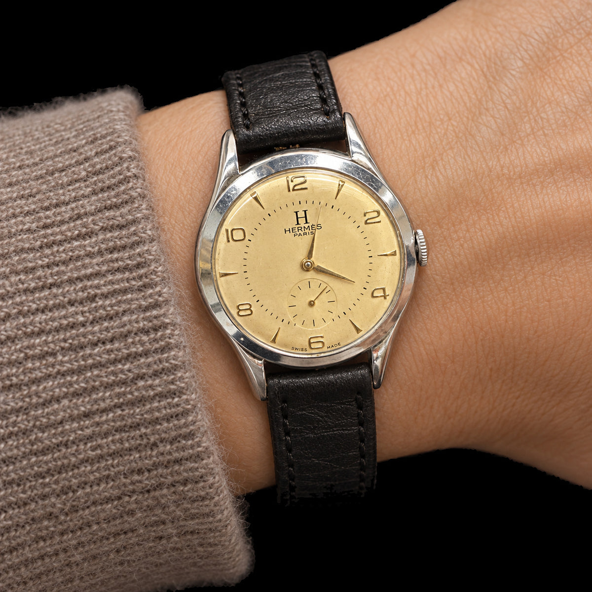 VINTAGE WATCH WITH HERMÈS SIGNED CHAMPAGNE DIAL — worn view