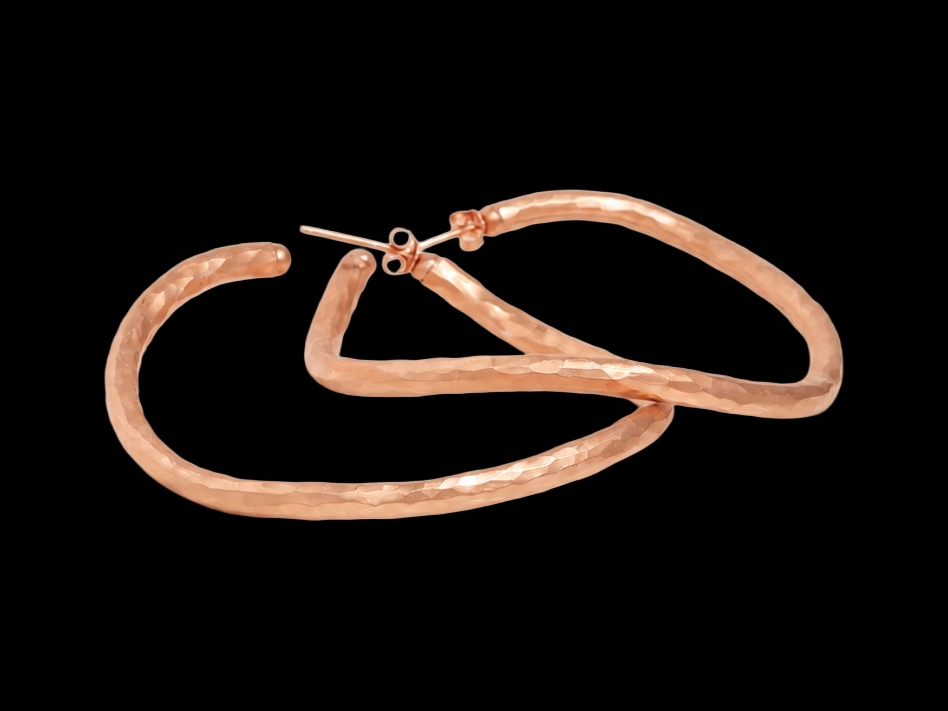 LARGE HAMMERED ROSE GOLD VERMEIL HOOP EARRINGS on black background