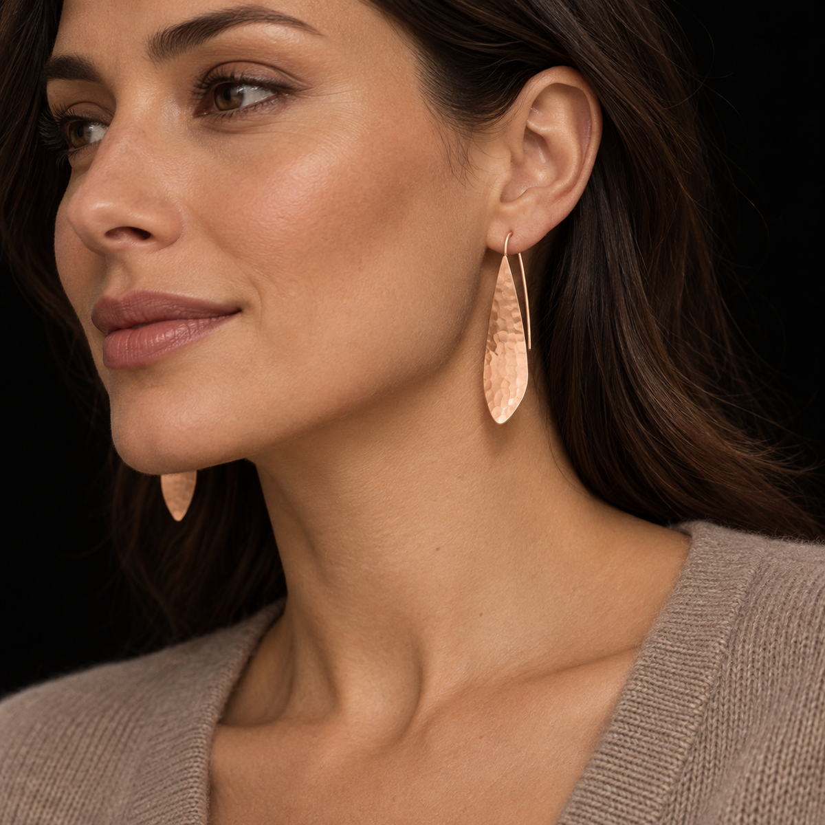 AI STYLING ILLUSTRATION OF LURE EARRINGS WORN WITH CASHMERE