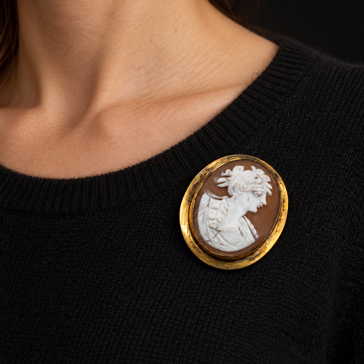 Illustrative wearing view of SHELL CAMEO WORN ON BLACK CASHMERE. SCALE IS APPROXIMATE.