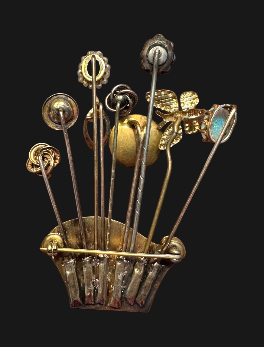 Reverse showing assembled stick pins and brooch clasp