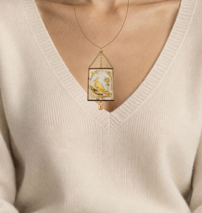 Illustrative close wearing detail of late 18th century french sentimental medallion with hairwork monogram & gilded reverse. Original photographed jewelry preserved; scale approximate.