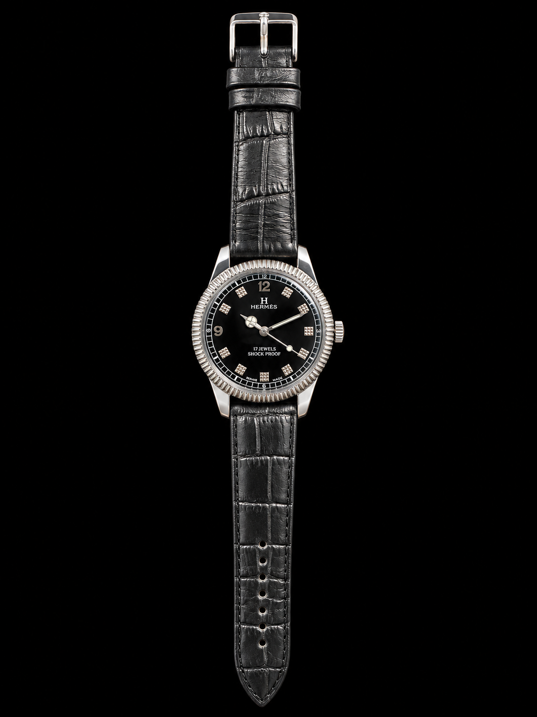 VINTAGE WATCH WITH HERMÈS SIGNED BLACK DIAL AND TEXTURED MARKERS ON BLACK BACKGROUND
