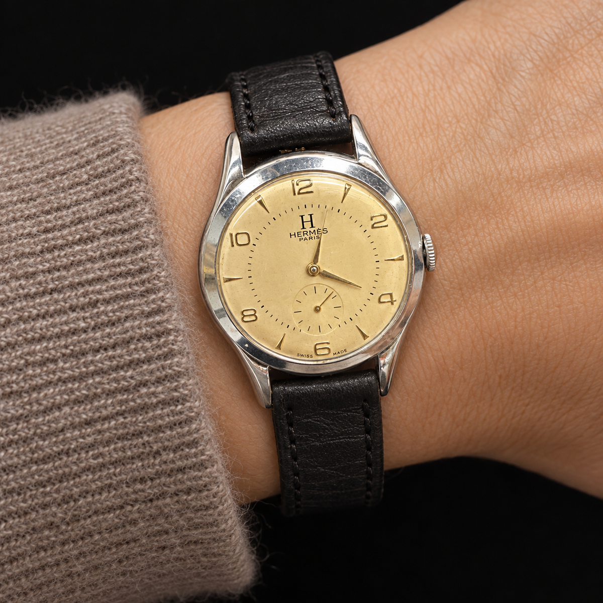ILLUSTRATIVE MODEL STYLING WITH VINTAGE WATCH WITH HERMÈS SIGNED CHAMPAGNE DIAL AND CASHMERE